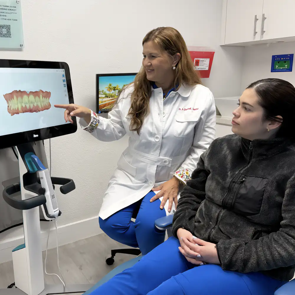 Dr. Gherbali reviewing a digital scan with a patient